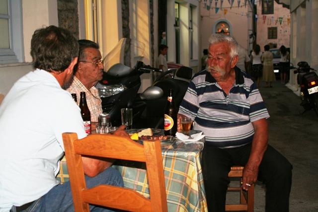Locals sitting outside the old 'Holy Gyros' in the Old Village